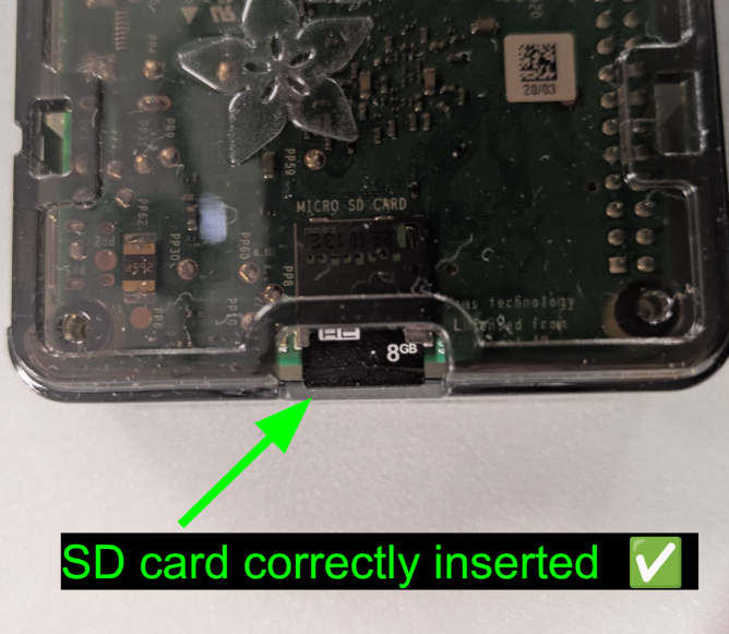Correctly-inserted microSD card.  The card should protrude just slightly